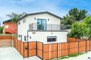 Completed ADU garage conversion with clean modern design and fenced outdoor space.