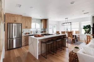 Modern kitchen remodel with wood cabinets, stainless steel appliances, and a stylish open layout.