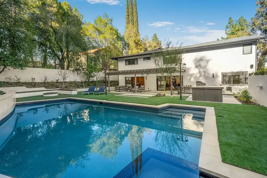 Home renovation with beautiful backyard, pool, and modern outdoor living area. Nobel Builders Canoga Park, CA