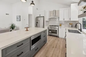 Modern kitchen with marble island and stainless steel appliances in a spacious layout