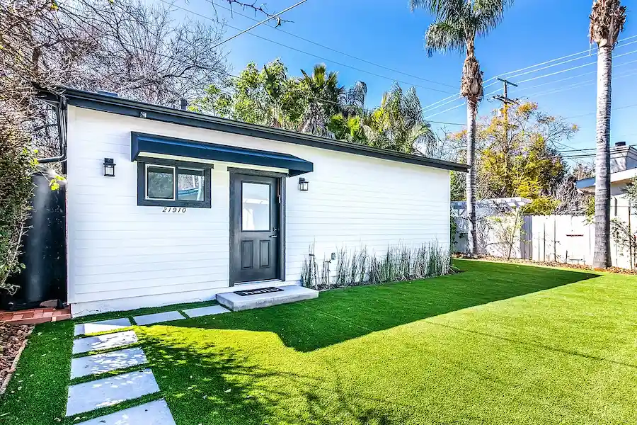 Completed ADU garage conversion with modern exterior and lush green front yard