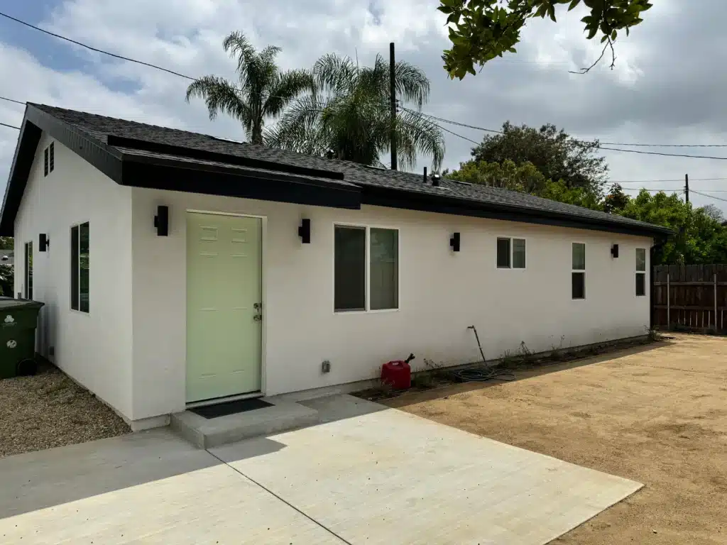 A wide perspective shot of the complete side of the single-story accessory dwelling unit (ADU).